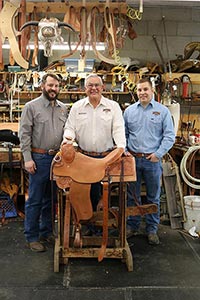 Richard Oliver, center, is 3rd generation of owner of Oliver Saddle Shop, a multi-generational, century old business in Amarillo, Texas. His sons Zeb, left, and Bryan, right, work alongside their father.
